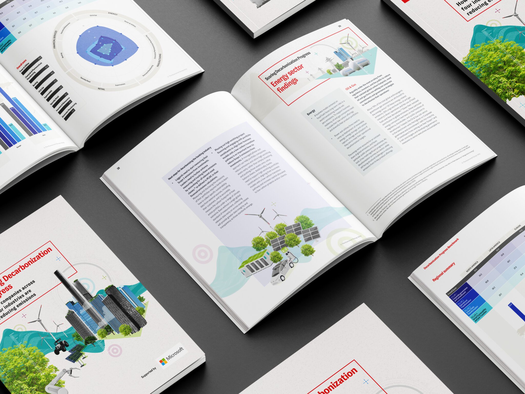 A collection of printed reports on Campaign Design, with infographics and illustrations spread out on a flat surface.